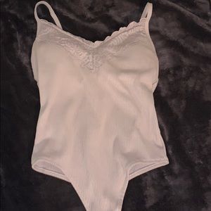 Two pink vs thong body suits.